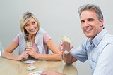 Couple with lime juices while playing cards at home
