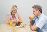 Concentrated couple playing chess