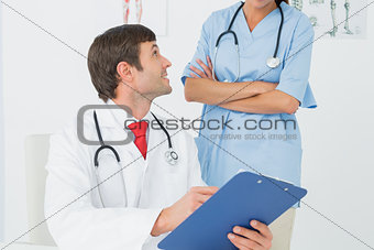 Doctors with reports in medical office