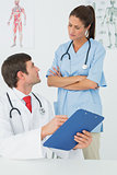 Doctors with reports in the medical office