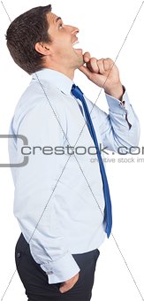 Thinking businessman touching his chin