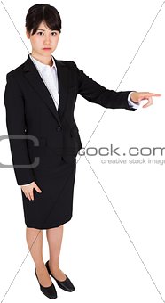 Focused businesswoman pointing