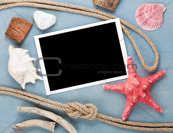 Travel photo frame on blue wooden texture