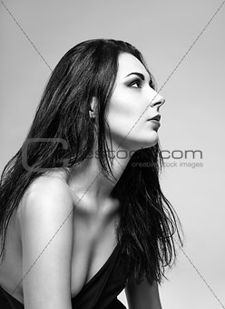 Studio portrait of beautiful girl. Profile view. Black and white