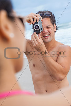 Couple at Beach Taking Photographs