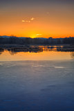 Sunset on iced water