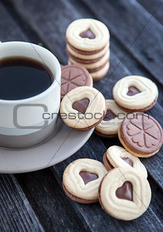 Cup of coffee and heart shaped cut out cookies