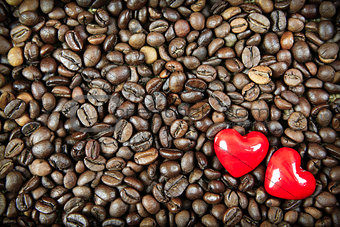 Two hearts on the coffee background