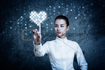 Woman Pointing at Glowing Digital Heart