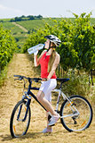 biker with bottle of water in vineyard, Czech Republic