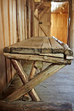 Wooden bench inside old hut