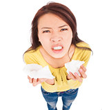 young woman holding tissue with painful face  