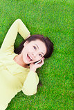High angle view of a young woman talking with smartphone