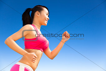  Runner woman jogging in sunny day
