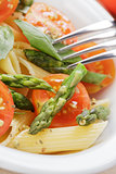 italian pasta penne with tomatoes and asparagus