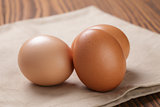 brown eggs  on napkin over table
