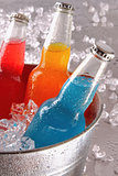 Bottles of cool drinks in ice bucket  