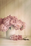 Peony flowers in vase with vintage colors