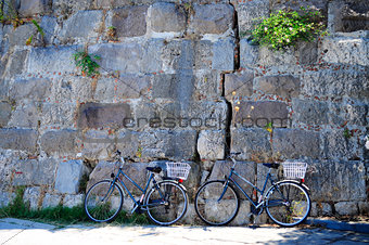 Bikes near stone wall