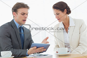 Smartly dressed couple in a business meeting