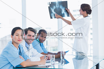 Doctor explaining xray to her team