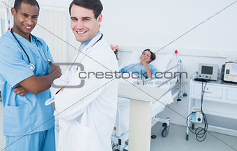Portrait of smiling doctors with patient at hospital