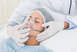 Female patient receiving artificial ventilation