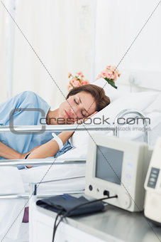 Female patient sleeping in medical bed