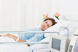 Female patient sleeping in medical bed