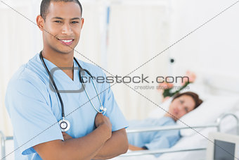 Smiling surgeon with patient in hospital