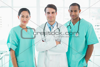 Three doctors standing together at hospital