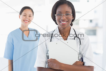 Portrait of a confident doctor and surgeon with report