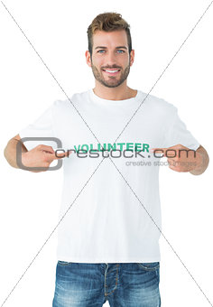 Portrait of a happy male volunteer pointing to himself