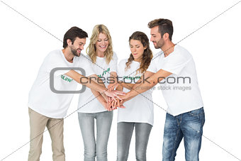Group of happy volunteers with hands together