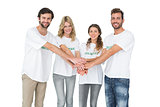 Group portrait of happy volunteers with hands together