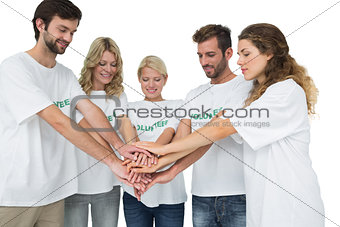 Group of young volunteers with hands together