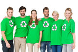 Group portrait of people wearing recycling symbol tshirts