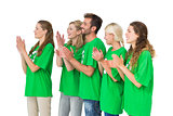 People in recycling symbol tshirts clapping hands