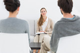 Female financial adviser in meeting with young couple
