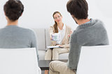 Female financial adviser in meeting with couple