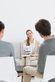 Female financial adviser in meeting with couple