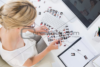 Female photo editor at work in the office