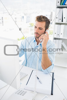 Concentrated male photo editor using phone