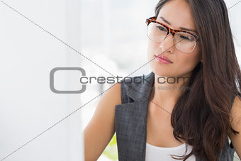 Concentrated young woman using computer