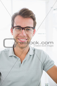 Portrait of a casual male photo editor smiling