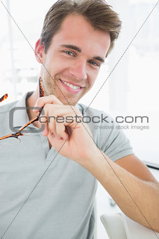 Portrait of a casual male photo editor smiling