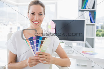 Portrait of a photo editor holding colors