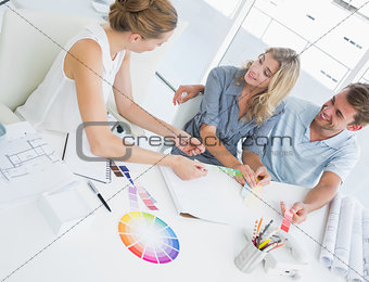 Group of artists working on designs