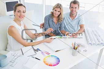 Group of artists working on designs
