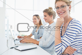 Three young people working in office